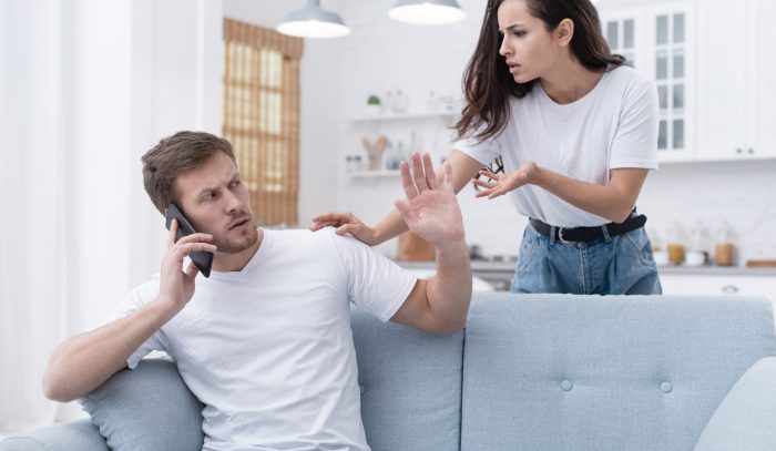 woman-arguing-with-her-boyfriend-while-he-is-talking-phone-scaled.jpg